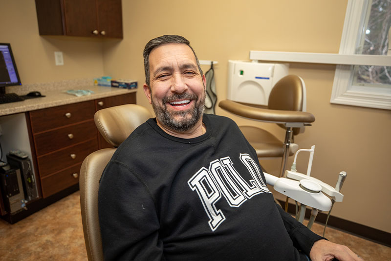Dental Implant Patient Smiling After His Full Mouth Dental Implants Were Placed